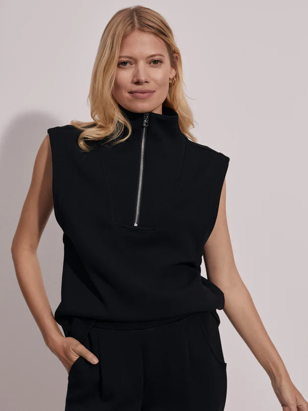 Black sleeveless tank with turtleneck and half silver zip fastening