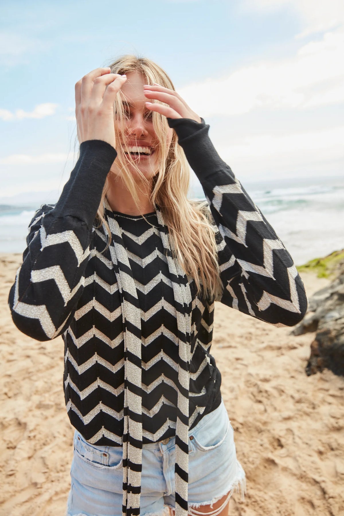 Black and silver chevron long sleeved top with crew neckline