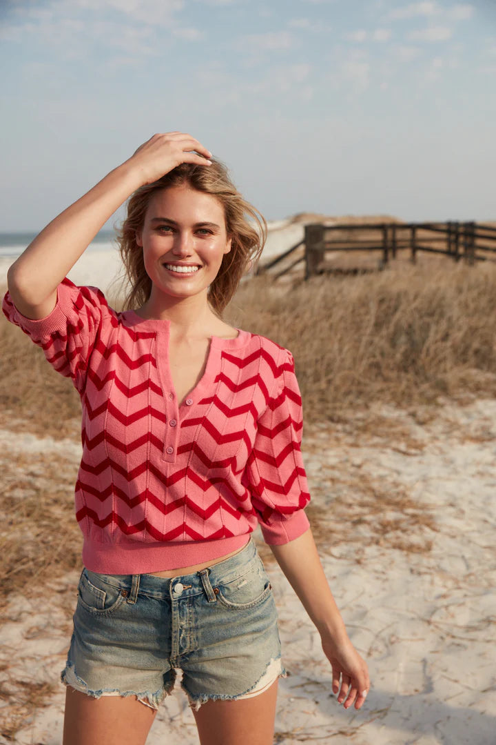 Pink and red chevron notch neck top and ribbed cuffs and hem