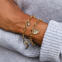 Chunky gold bracelet with pave diamond gold plated fan pendant