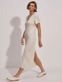 Soft cream ribbed knitted cotton dress with short grown on sleeves and notch neckline with aesthetic button details figure hugging