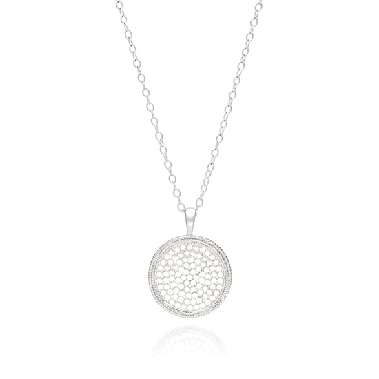 long silver chain necklace with a large sterling silver medallion pendant