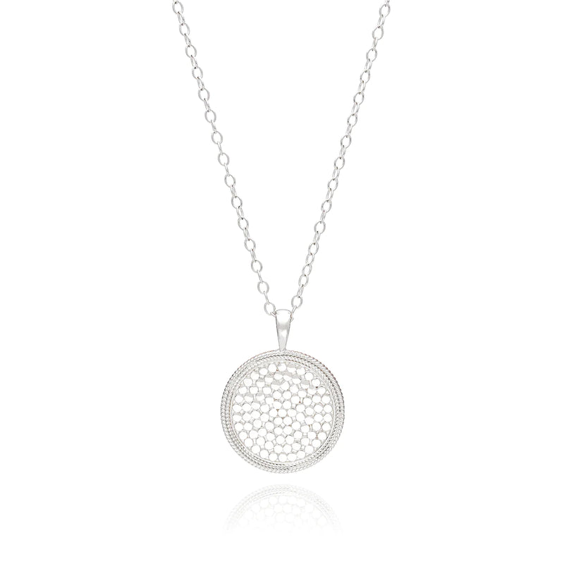 long silver chain necklace with a large sterling silver medallion pendant