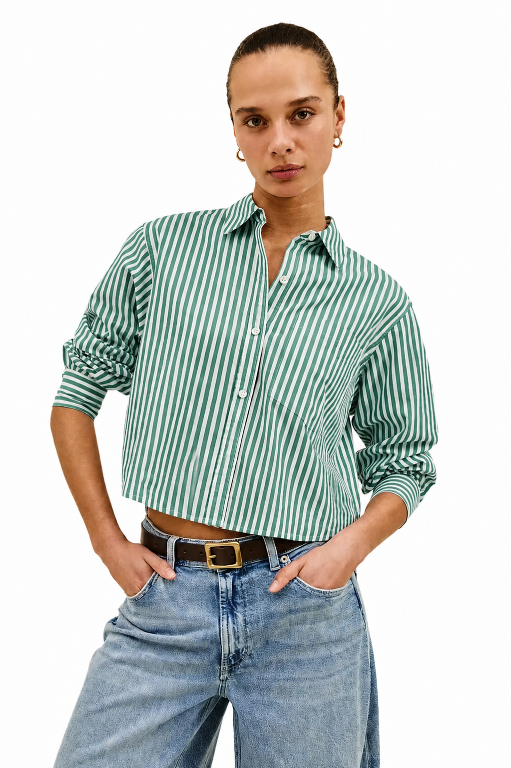Person wearing a green and white striped shirt and blue jeans on a white background