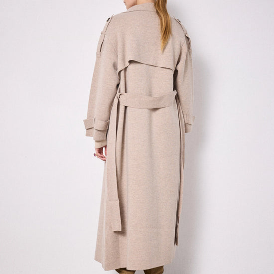 Rear view of beige knitted trench coat