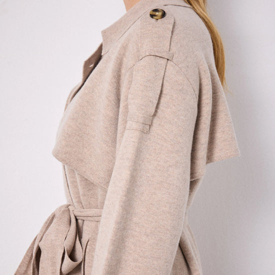 Side view of shoulder of knitted trench