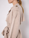 Side view of shoulder of knitted trench