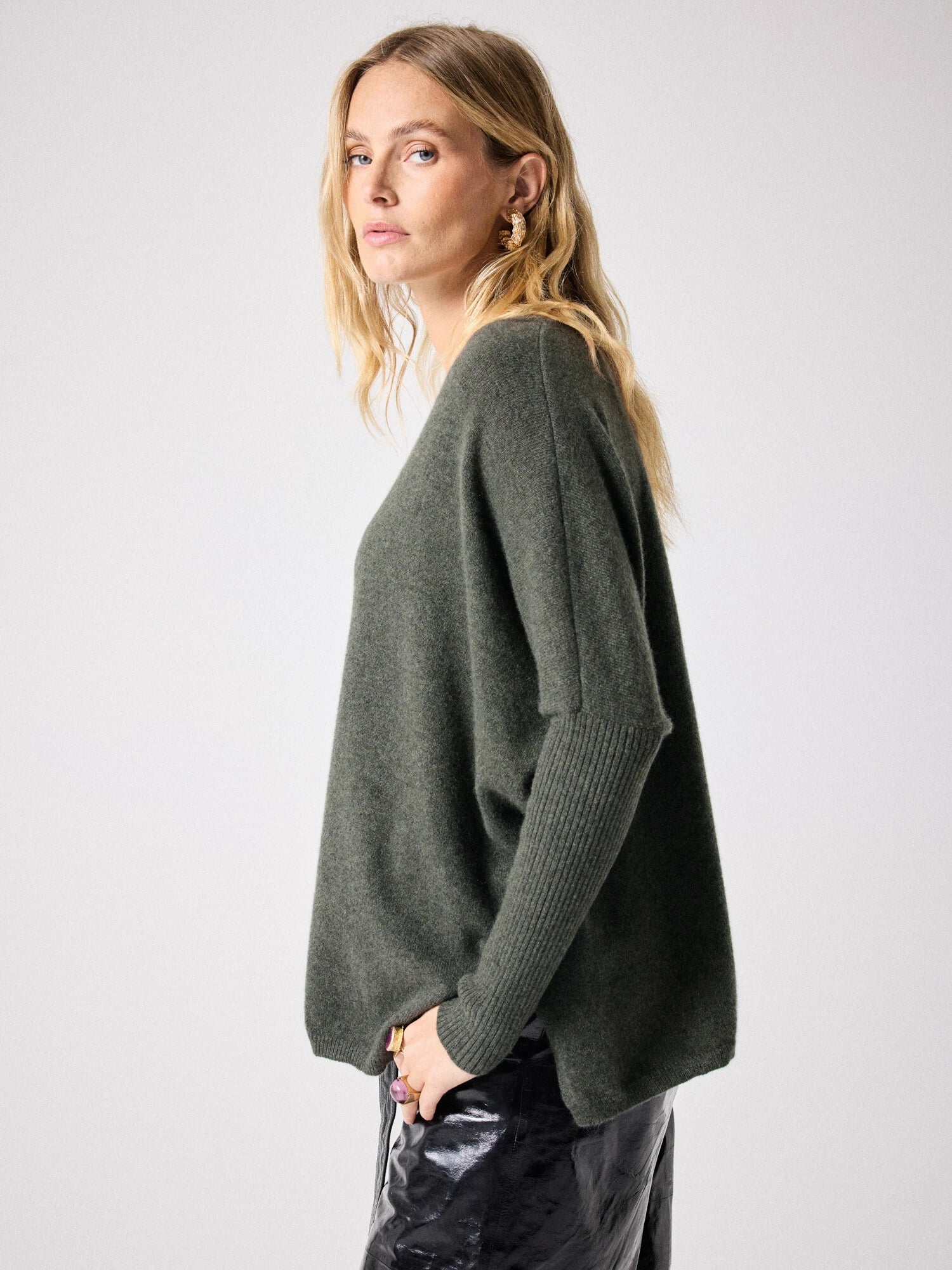 Side view of Dark green deep V cashmere knit with boxy fit