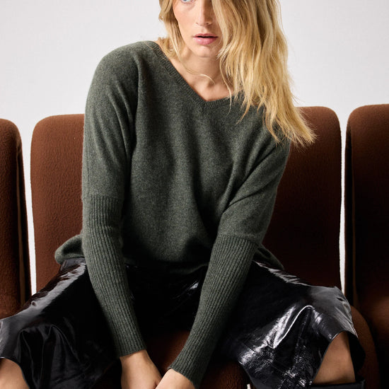 Dark green deep V cashmere knit with boxy fit model shot