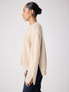 beige cashmere knit with ribbed neck and split cuffs  side view