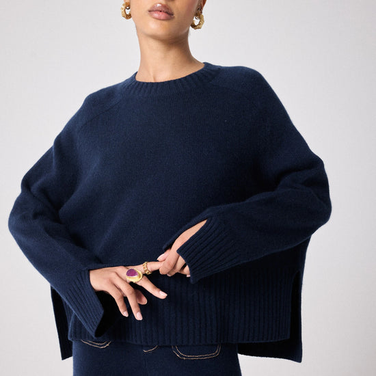 navy cashmere knit with round ribbed neck and split cuffs 