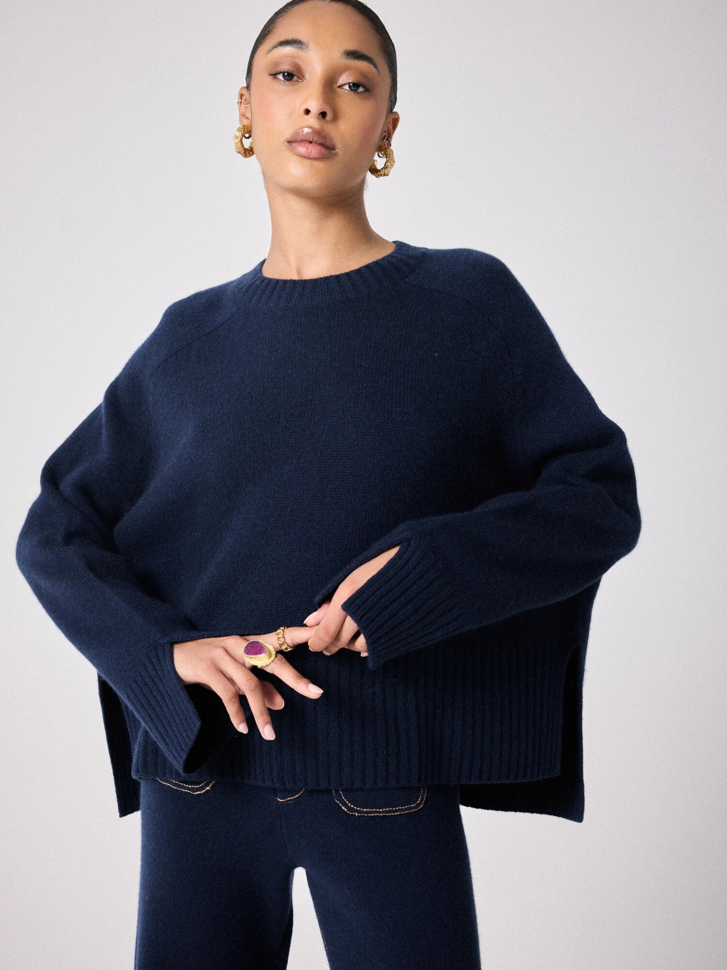 navy cashmere knit with round ribbed neck and split cuffs 