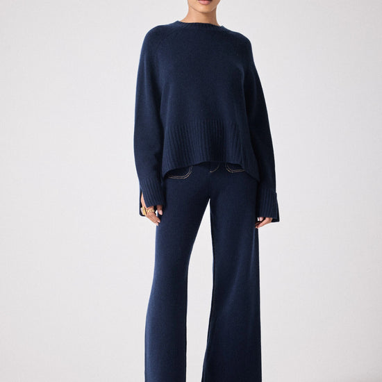 navy cashmere knit with round ribbed neck and split cuffs  model shot 