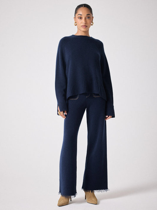 navy cashmere knit with round ribbed neck and split cuffs  model shot 