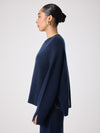 navy cashmere knit with round ribbed neck and split cuffs  side view 