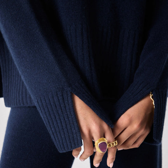 navy cashmere knit with round ribbed neck and split cuffs  close up of cuffs