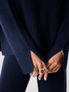 navy cashmere knit with round ribbed neck and split cuffs  close up of cuffs