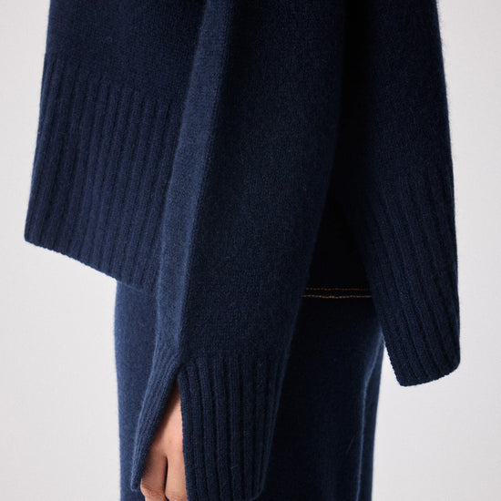 navy cashmere knit with round ribbed neck and split cuffs close up