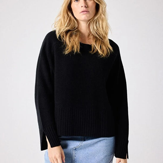 Black cashmere knit styled with denim