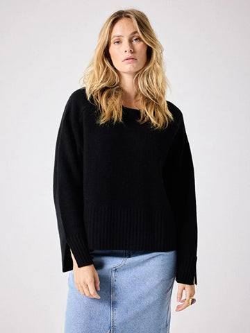 Black cashmere knit styled with denim