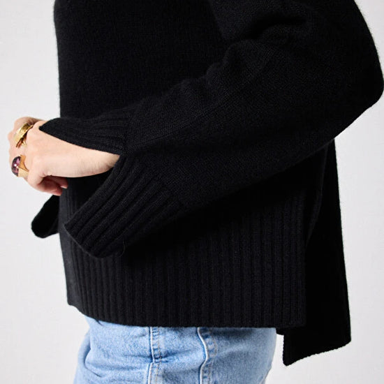 Black cashmere knit styled with denim