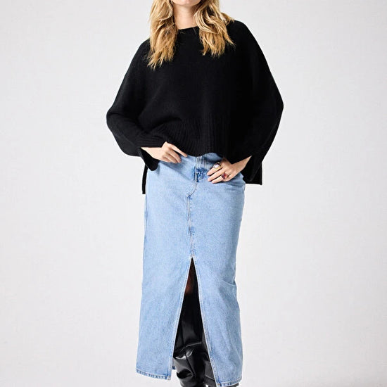 Black cashmere knit styled with denim