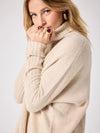 long sleeved roll neck beige jumpe