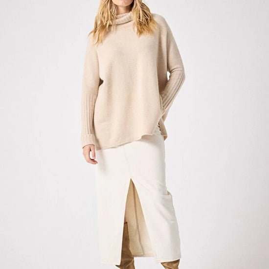 long sleeved roll neck beige jumpe