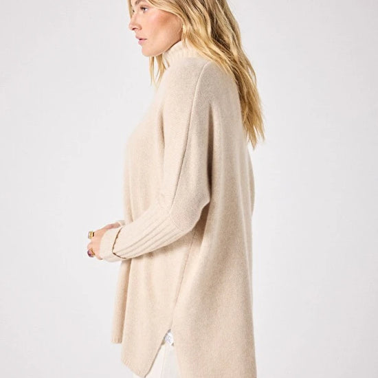 long sleeved roll neck beige jumpe