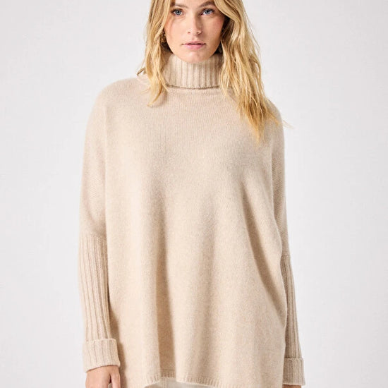 long sleeved roll neck beige jumper