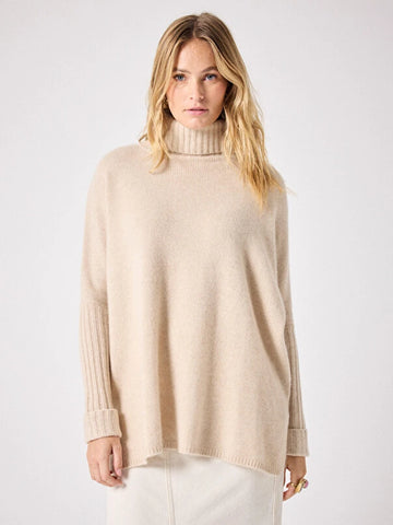 long sleeved roll neck beige jumper