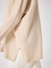 long sleeved roll neck beige jumpe