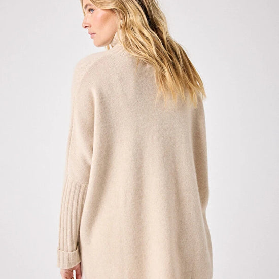 long sleeved roll neck beige jumpe