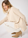 long sleeved roll neck beige jumpe