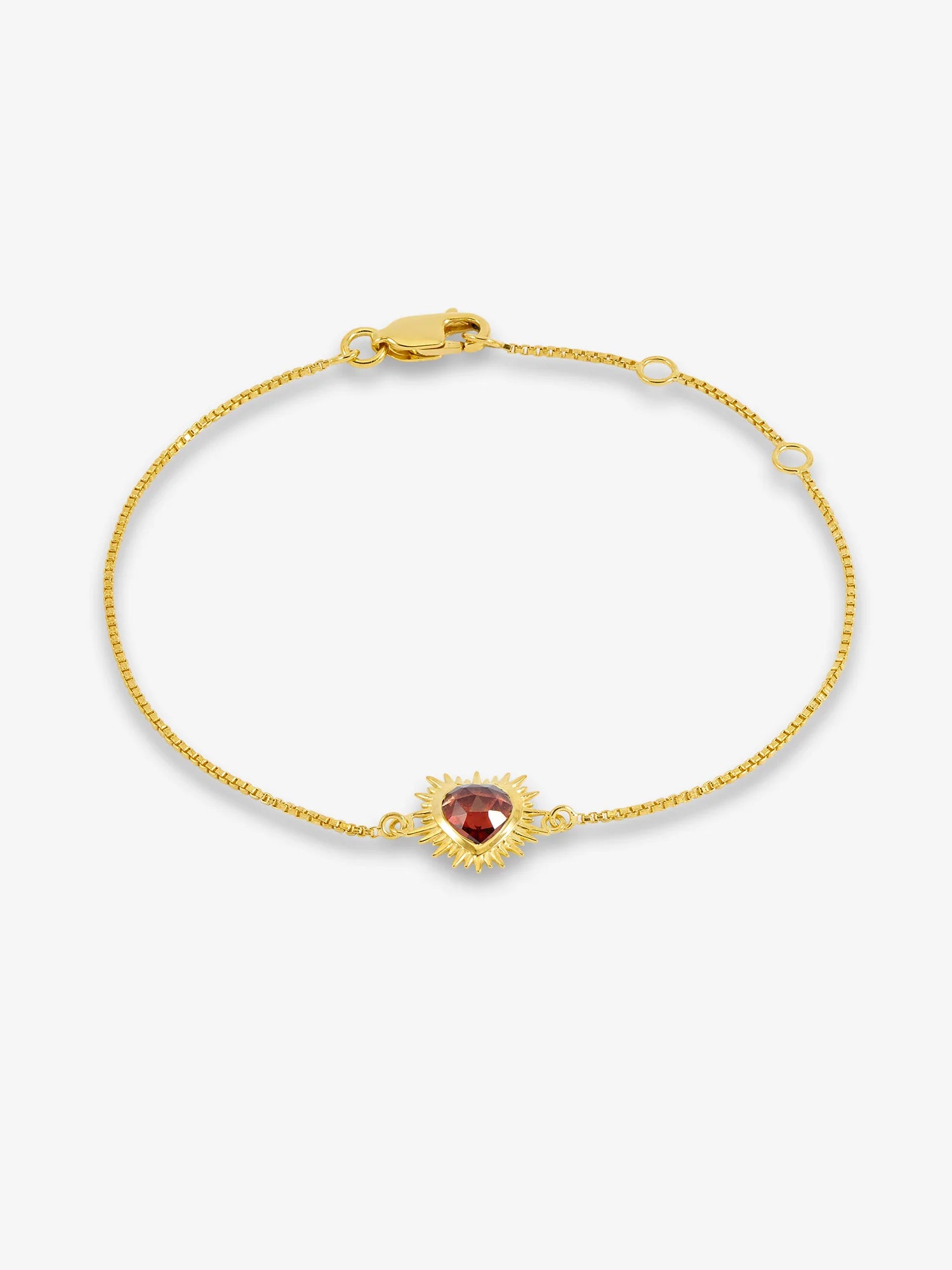 gold bracelet with spiky heart with red stone inside and lobster clasp from rachel jackson