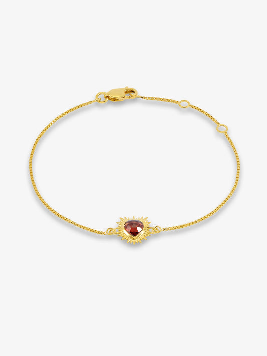 gold bracelet with spiky heart with red stone inside and lobster clasp from rachel jackson