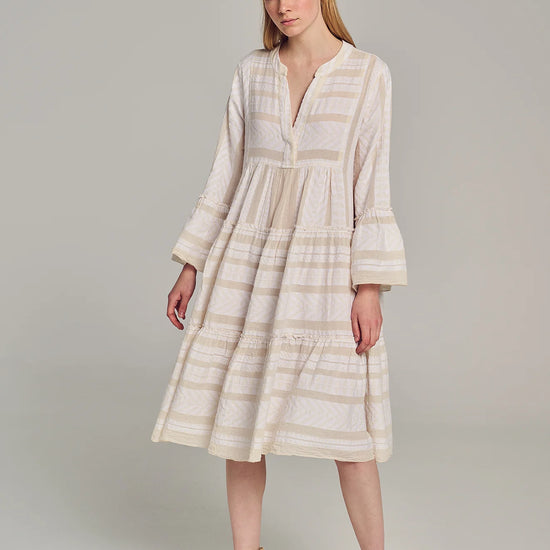 Ecru notch neck midi dress with long fluted sleeves and tripe tiered A line skirt with off-white embroidery throughout