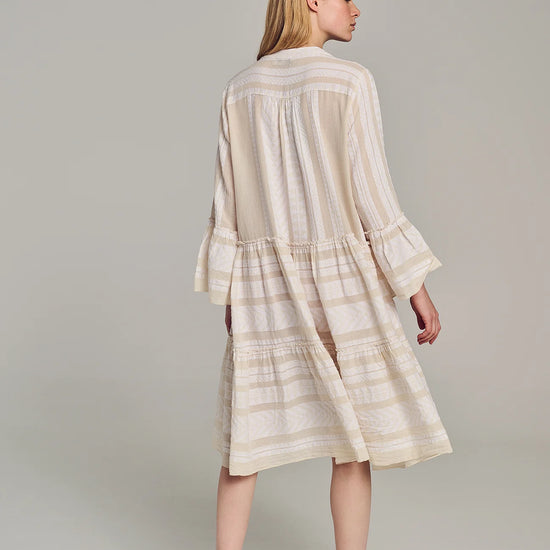 Ecru notch neck midi dress with long fluted sleeves and tripe tiered A line skirt with off-white embroidery throughout