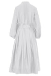 White midi dress with half placket full skirt long sleeves collar and statement box pleats at waist and belt loops