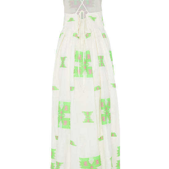 Ecru midi dress with empire line and spaghetti straps that cross at the back with green and pink abstract woven design throughout