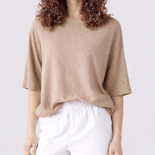 Short sleeve cashmere knit worn with white trousers