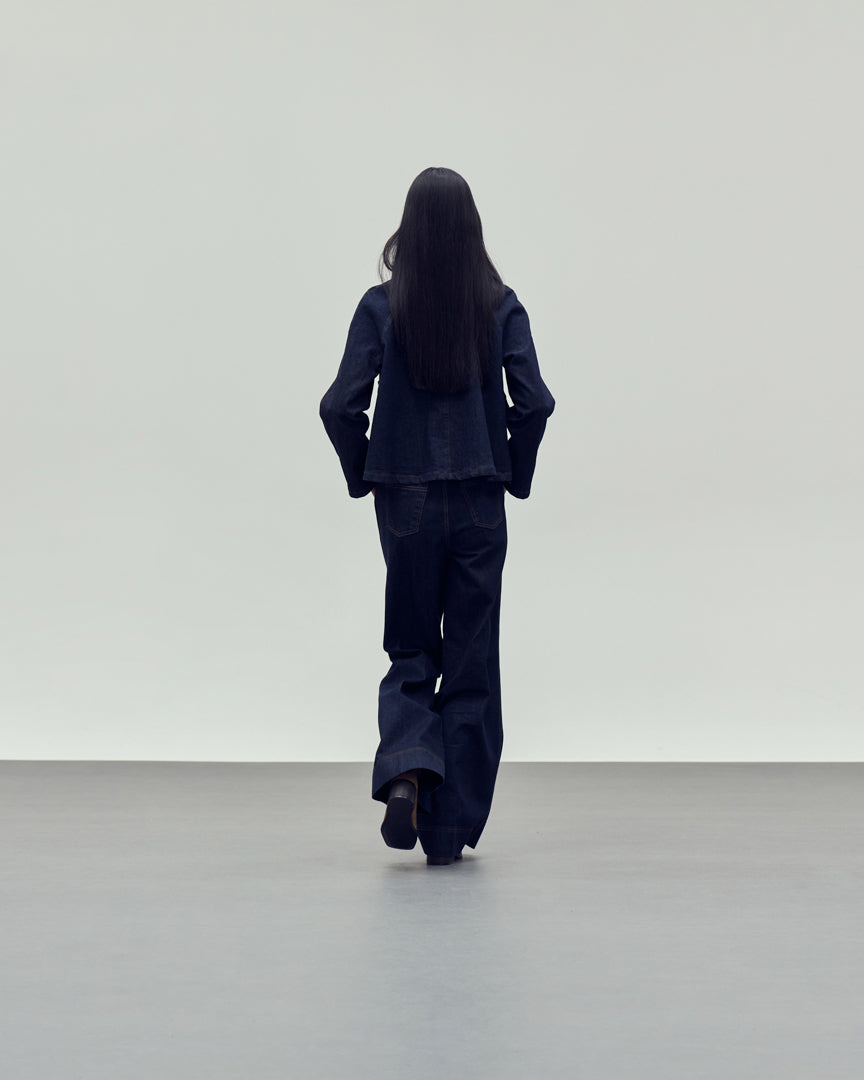 dark blue denim jacket with brown collar rear view