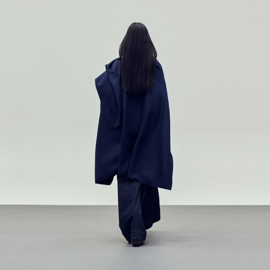 Blue cape style coat rear view