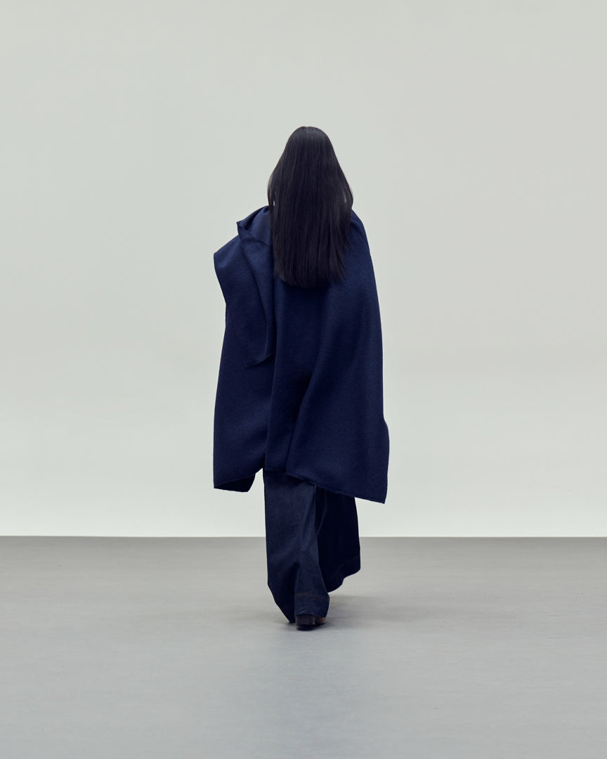 Blue cape style coat rear view
