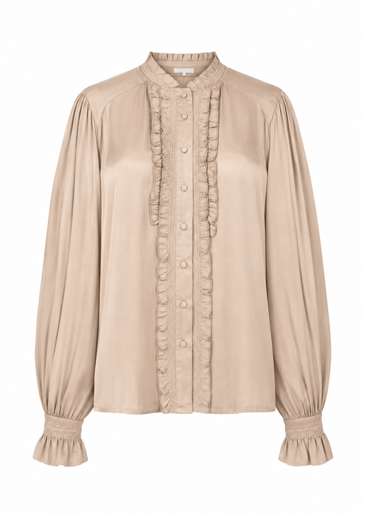 A beige long-sleeve blouse with a high mandarin collar, gathered sleeves, and vertical ruffle trim down the front button placket, shown on a plain white background.