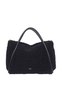 navy shearling bag with shoulder strap and optional cross body strap