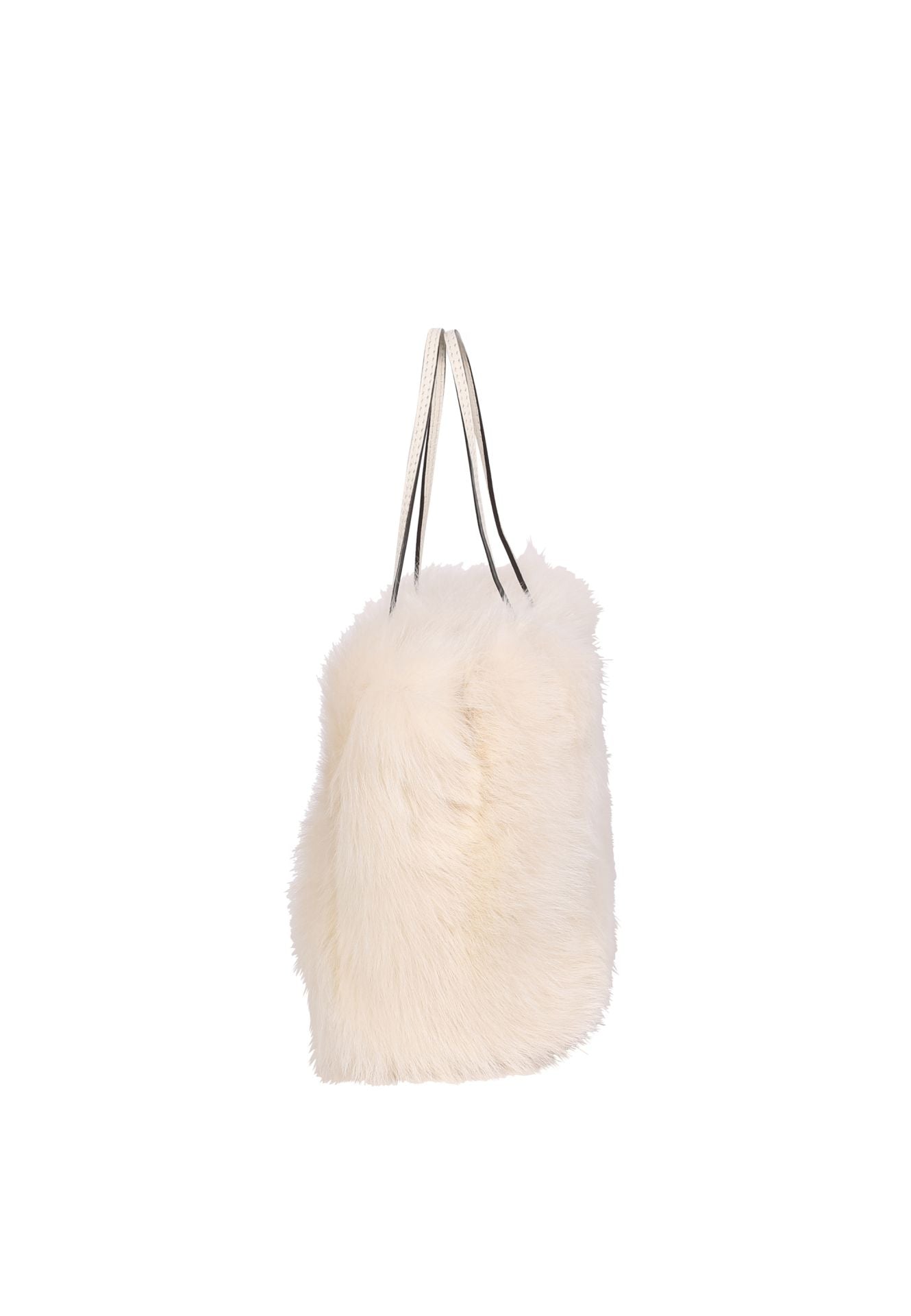 Side view of the cream shearling bag