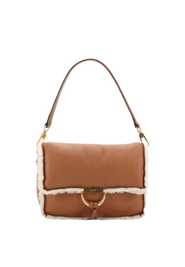 tan leather cross body leather bag with top handle and white shearling interior and edging from abro