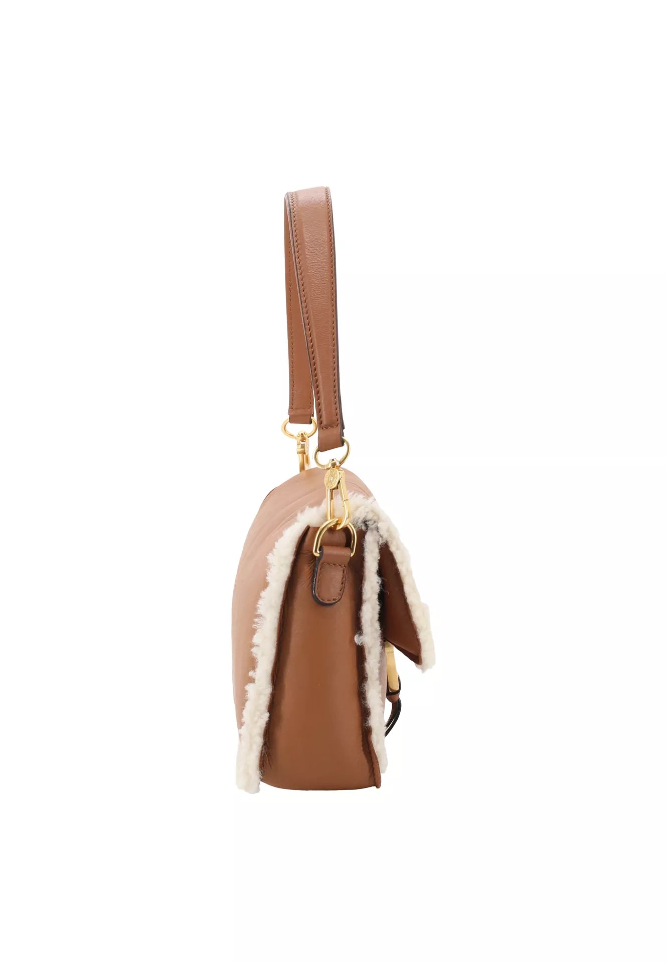 tan leather cross body leather bag with top handle and white shearling interior and edging from abro side view