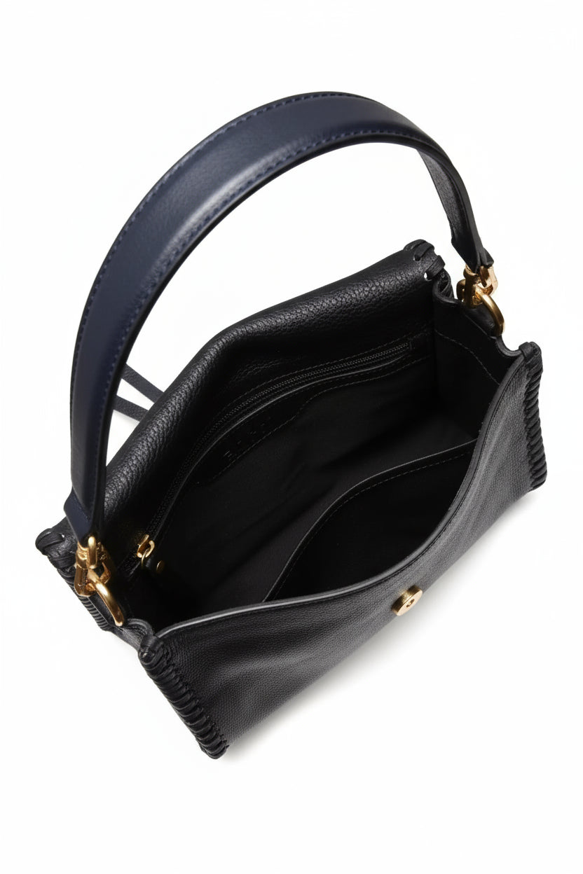 navy leather handbag with gold toned hardwear